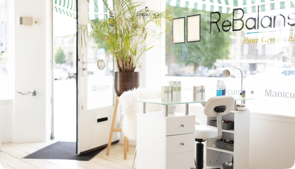 a spa beauty salon Rebalans with a glass table and chair